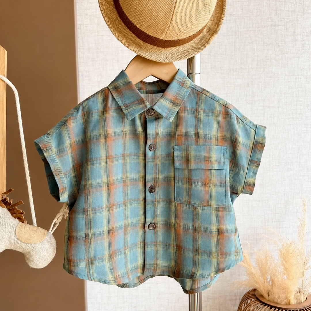 Front view of the blue plaid shirt with collar and chest pocket