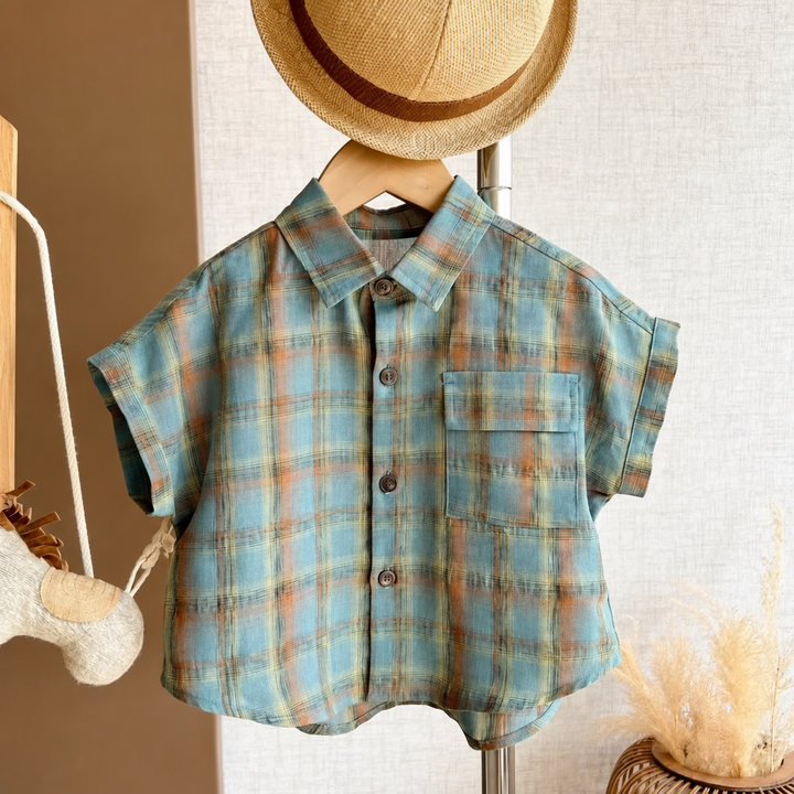 Front view of the blue plaid shirt with collar and chest pocket