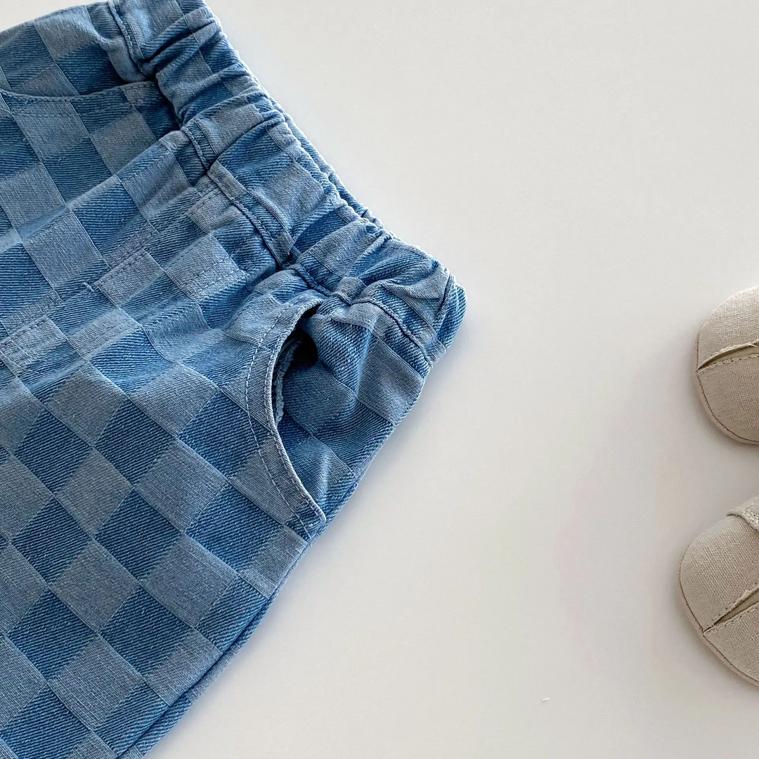 Side pocket and gathered elastic waistband on blue checkerboard pants