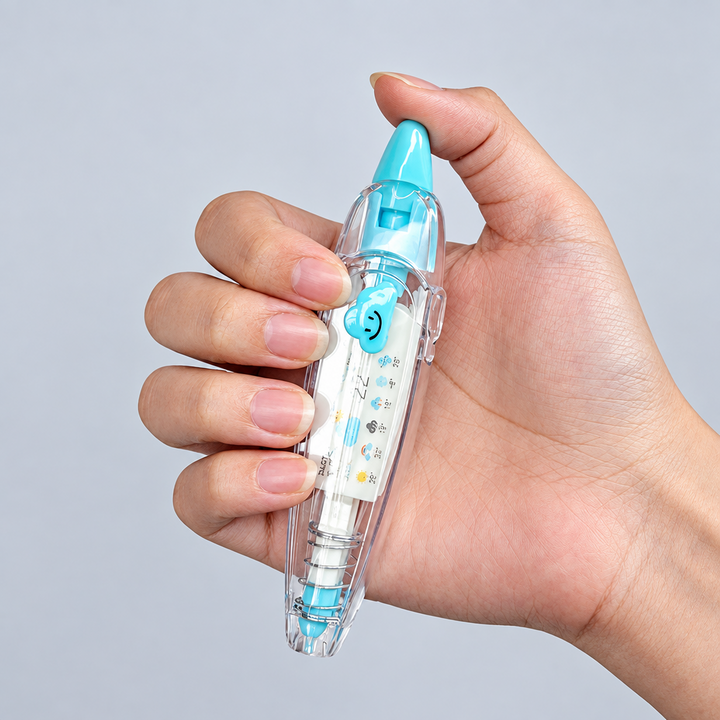 Hand holding a clear decorative tape dispenser with a blue tip and cloud-shaped detail.
