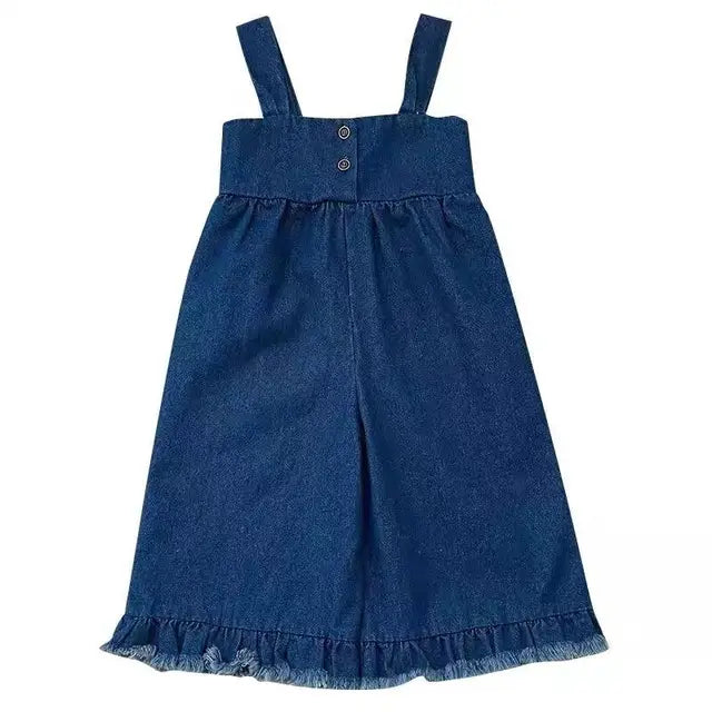 Front view of blue cotton overalls with wide legs, shoulder straps and fringed hems