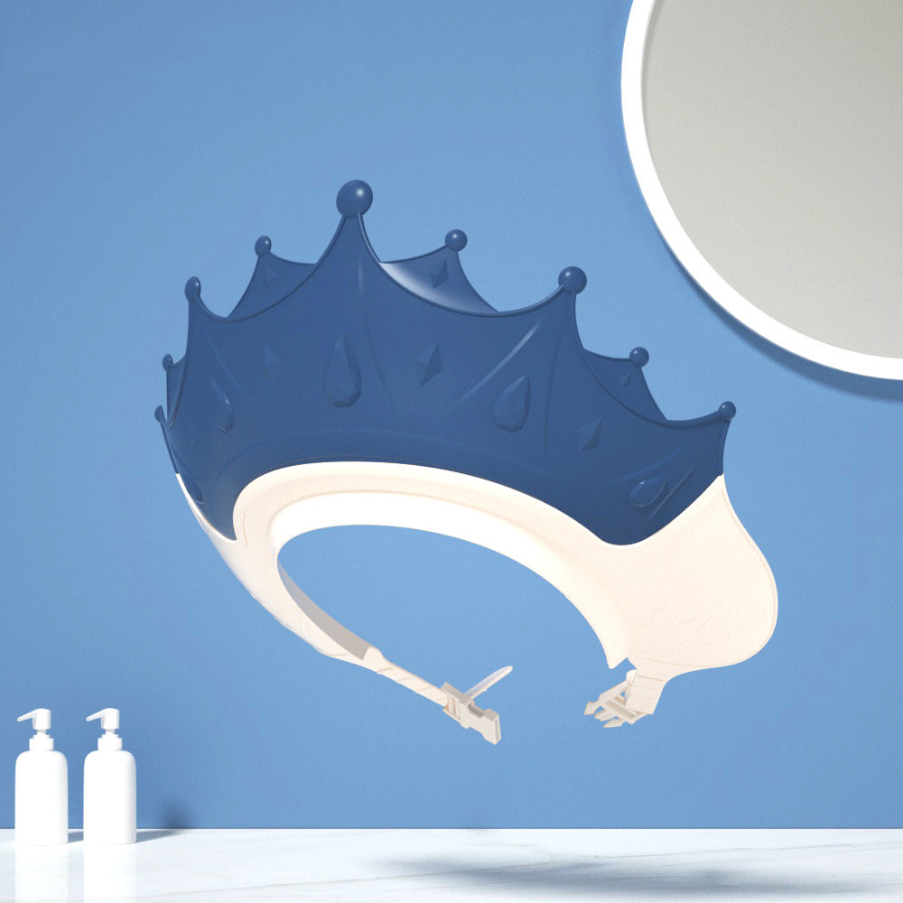 Blue crown-shaped bath cap with a white band and buckle