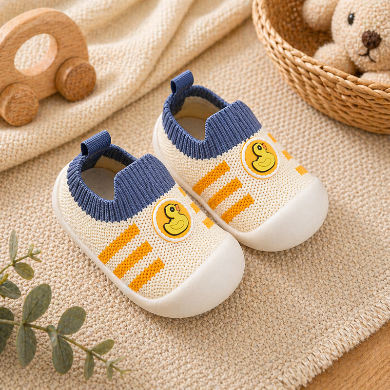 Duck-detail baby sock shoes with blue cuffs, yellow stripes, and white soles.