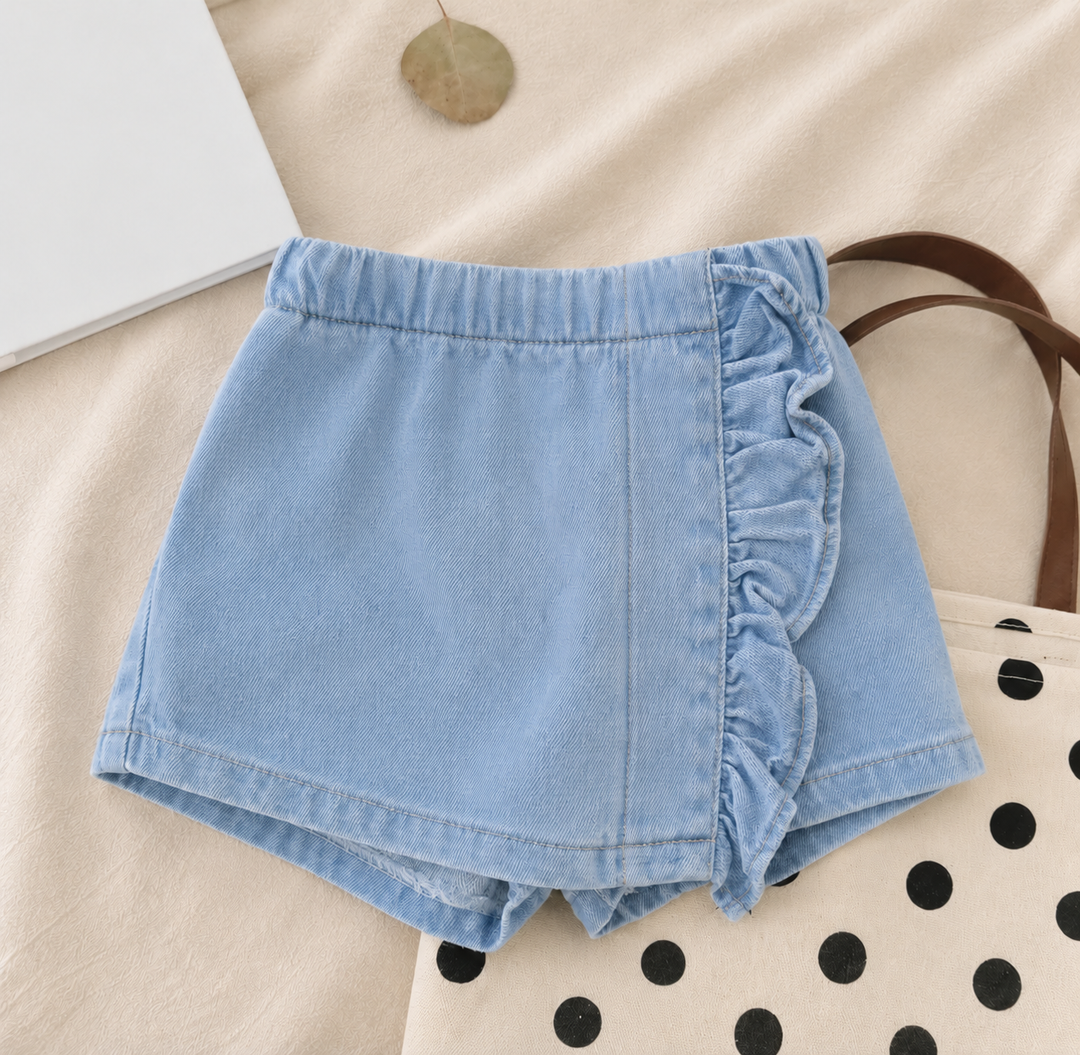 Blue denim skirt with a ruffled front panel, elastic waist and shorts underneath