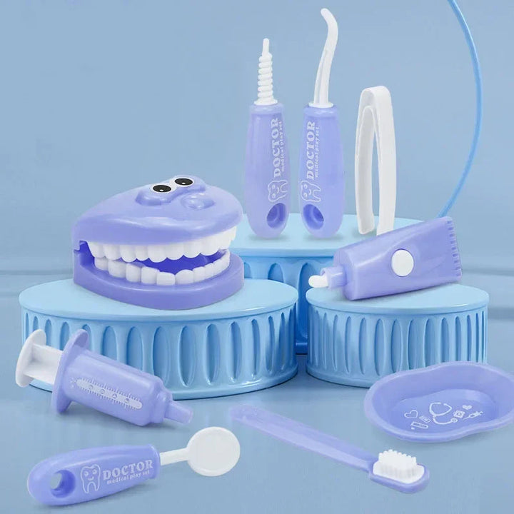 Blue tooth model and dental play tools arranged on blue display stands