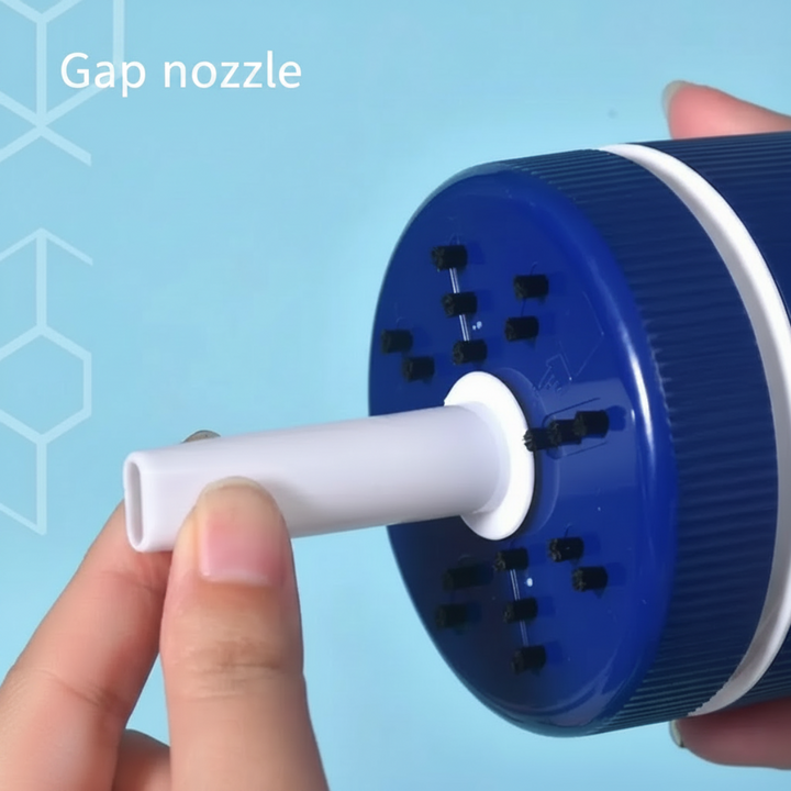 White cleaning nozzle fitted into the underside of a dark blue desktop cleaner
