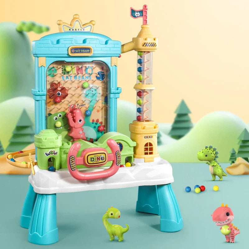 Blue castle-style electric ball catcher with dinosaur figures, a front steering wheel and a yellow spiral tower.