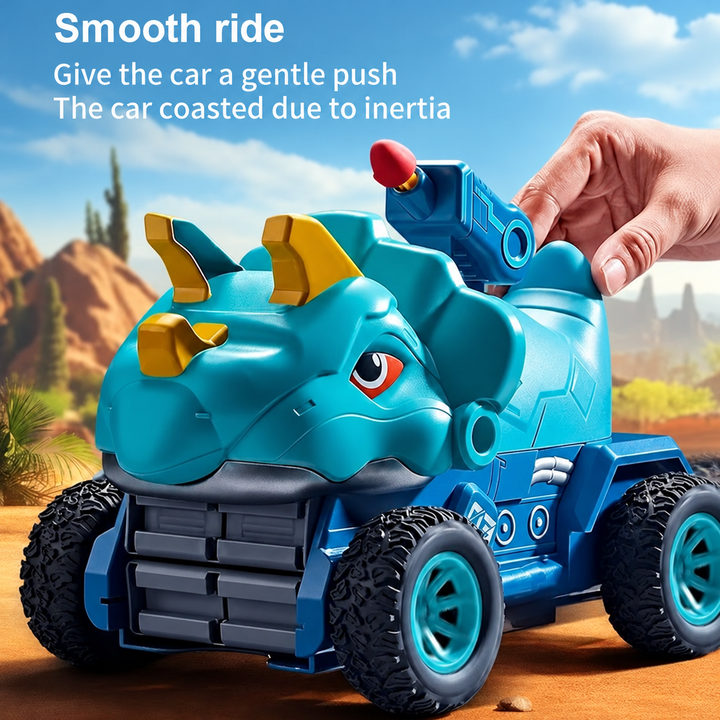 Hand pushing a blue dinosaur toy car with large treaded wheels