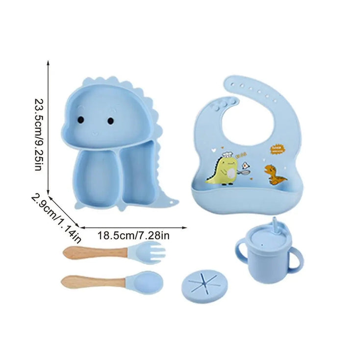 Blue dinosaur tableware set with a plate measurement chart showing 23.5 x 18.5 x 2.9 cm