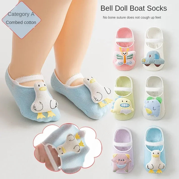 Blue duck-design baby socks shown on feet beside other pastel character styles