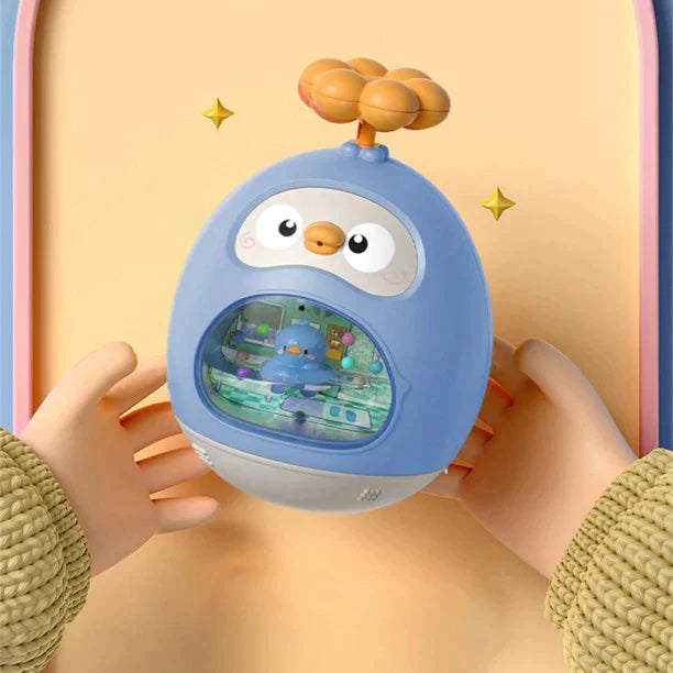 Hands holding a blue duck-shaped bath toy with an orange handle and clear front window