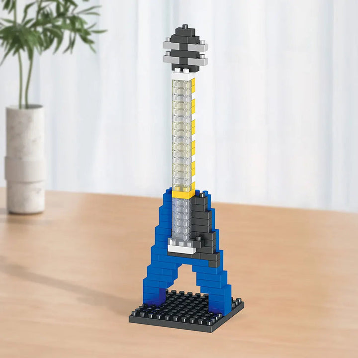 Blue electric guitar block model with a long gray neck and black base