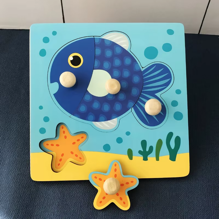 Fish wooden peg puzzle with a large blue fish and a removable starfish piece