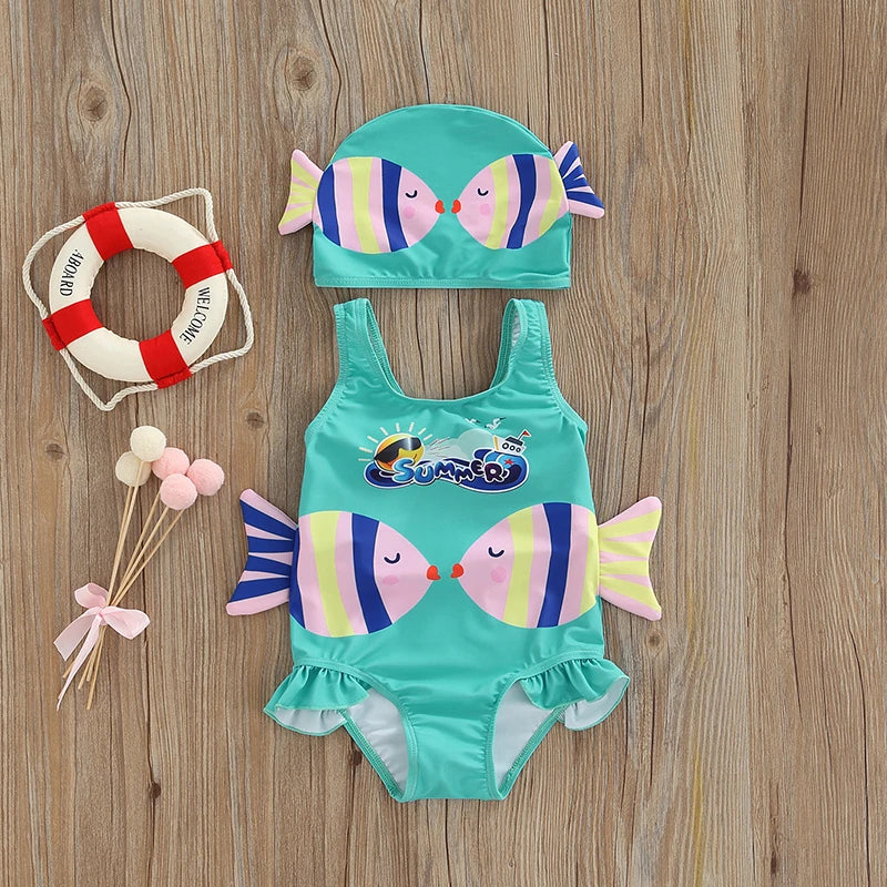 Blue fish-print one-piece swimsuit with decorative side fins and a matching cap