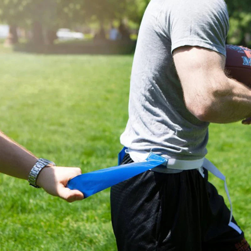 A player pulls a blue flag from another player&