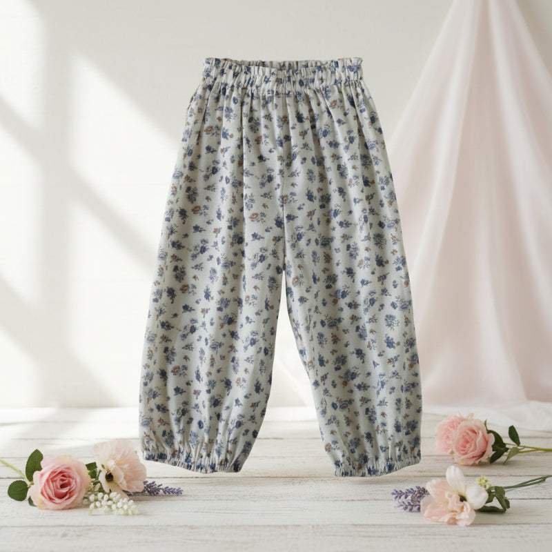 Blue floral harem pants with an elastic waist and gathered ankle cuffs.