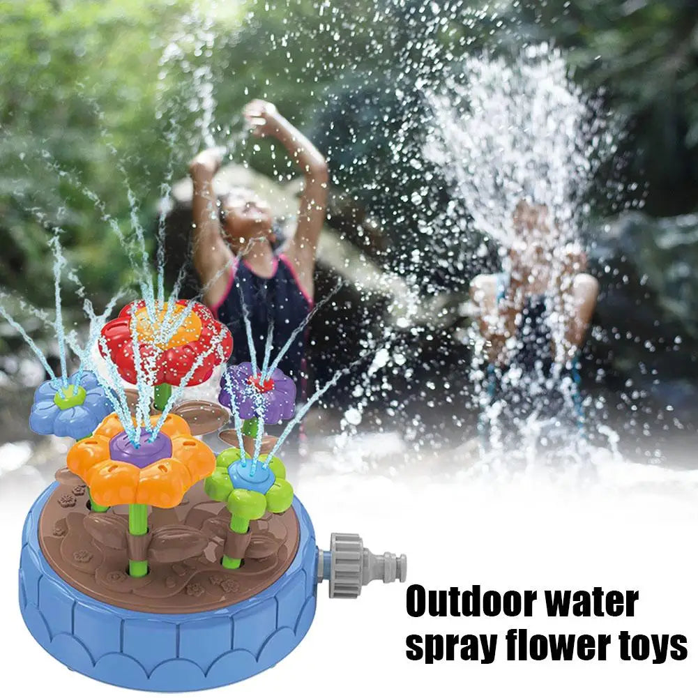 Blue flower sprinkler spraying water with children playing in the background