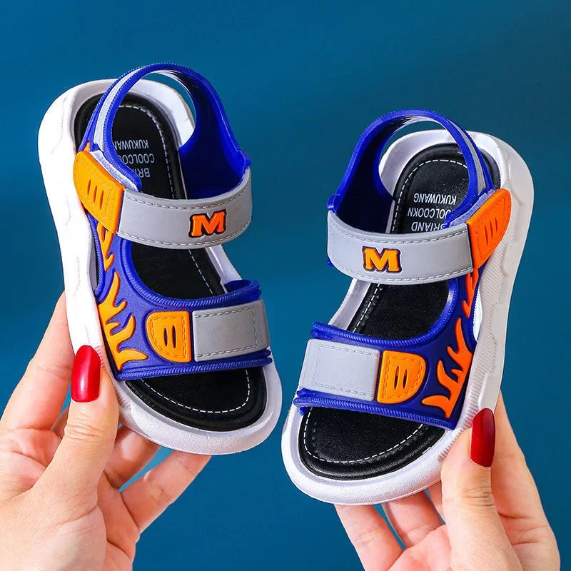 Blue and gray sandals with orange flame graphics and white soles