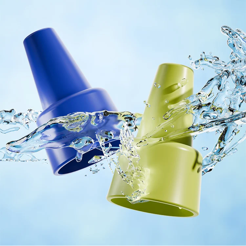 Blue and green toy horn mouthpieces pictured with splashing water