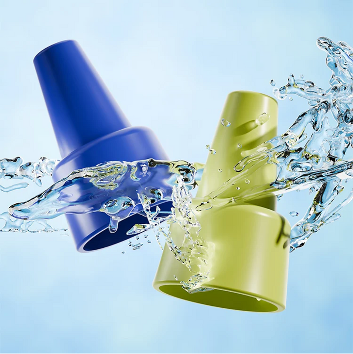Blue and green toy horn mouthpieces pictured with splashing water