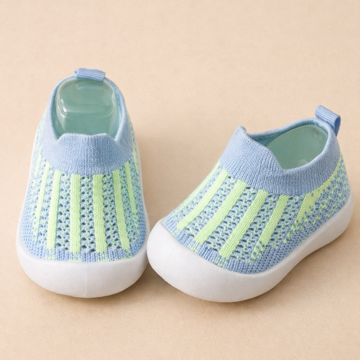 Blue mesh sneakers with light green vertical stripes and white soles.