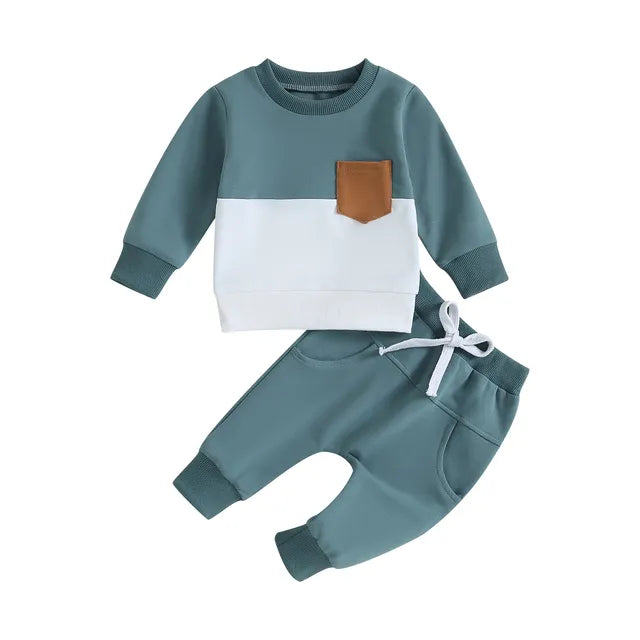 Blue-green sweatshirt with a white lower panel and tan pocket paired with matching joggers