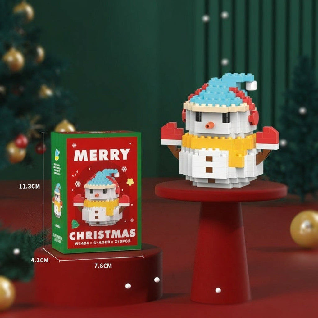 Mini snowman block figure wearing a blue hat and yellow scarf beside its box