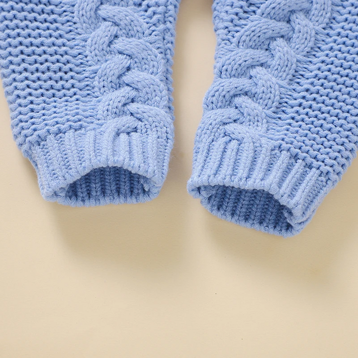 Blue baby jumpsuit legs with cable-knit detailing and ribbed ankle cuffs