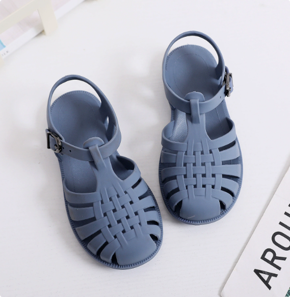 Blue children's sandals with open basketweave fronts and adjustable buckle straps