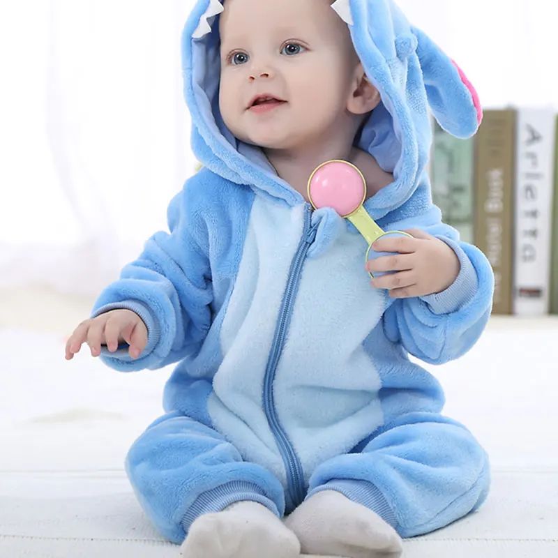 Baby seated in a blue hooded onesie with long ears and a light blue belly panel