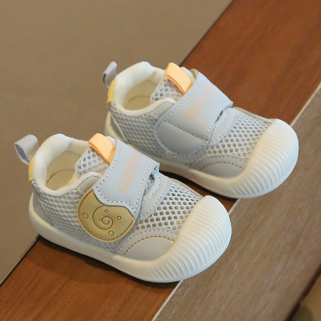 Blue mesh toddler sneakers with wide straps, bear details and white toe caps