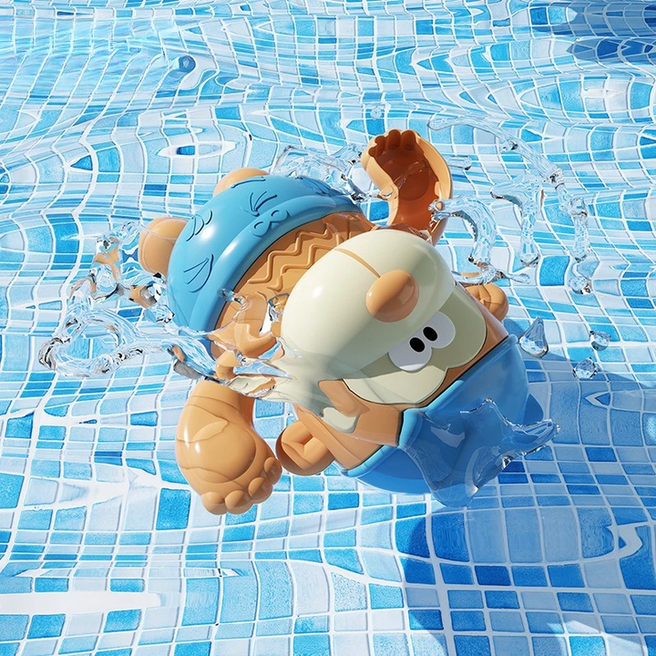 Blue wind-up monkey bath toy tilted in blue-tiled pool water