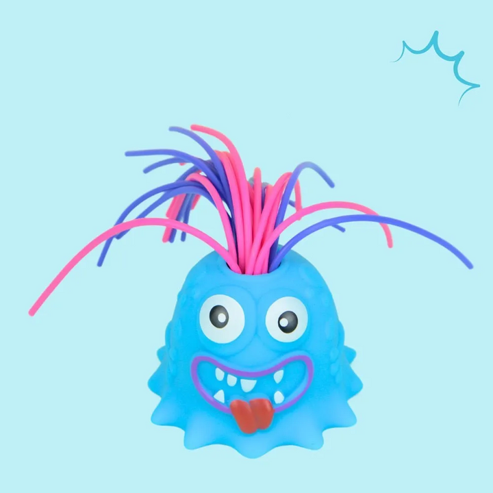 Blue monster stress toy with two eyes, pink and purple hair, and a tongue-out smile