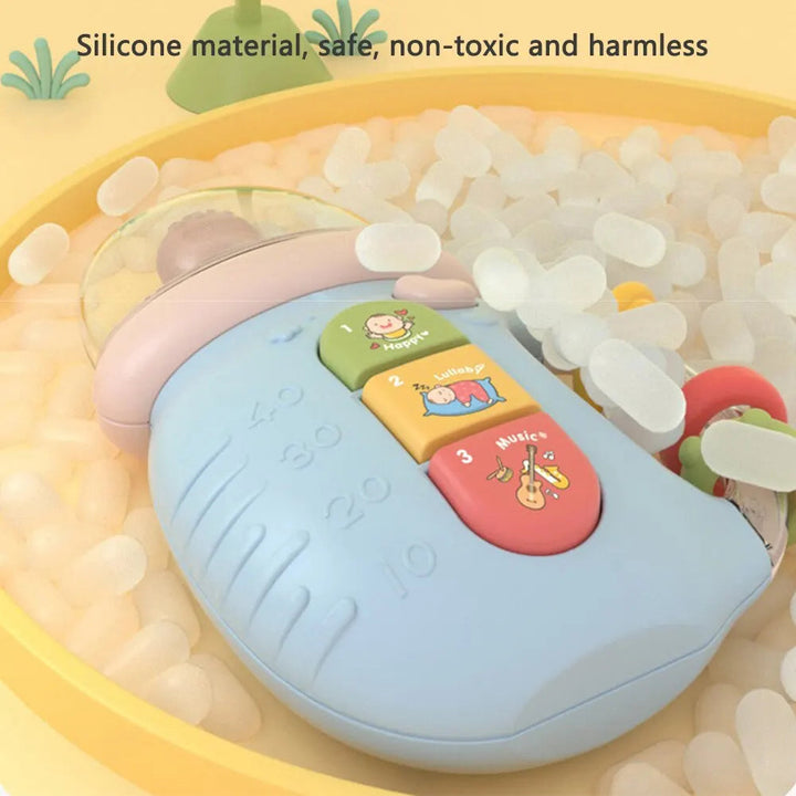 Blue musical bottle toy showing three colorful front buttons and a curved side handle.