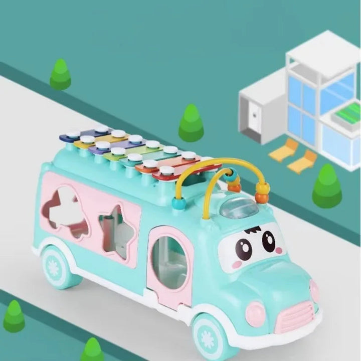 Blue musical toy bus with shaped windows and colorful roof keys on an illustrated road
