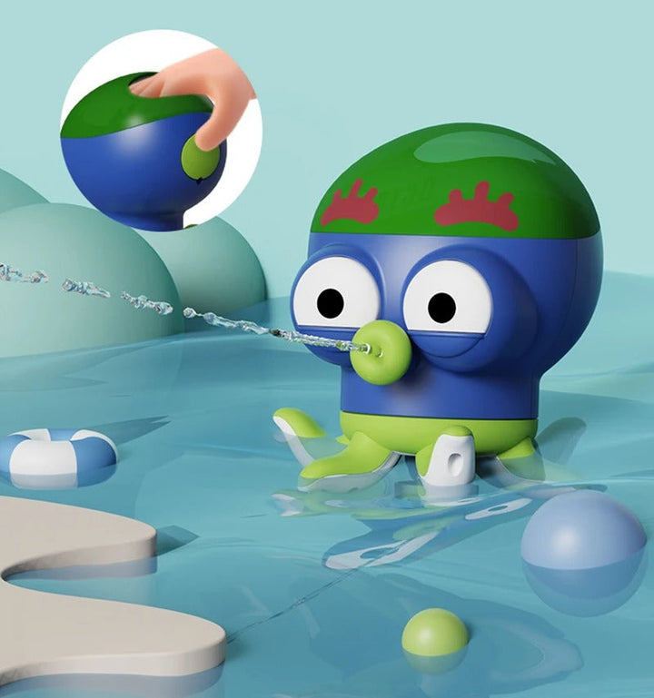 Blue octopus bath toy spraying water, with an inset showing a hand pressing its green top
