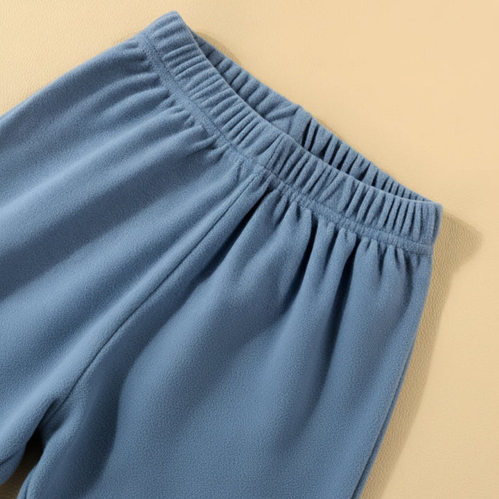 Elastic waistband on the blue pajama pants.