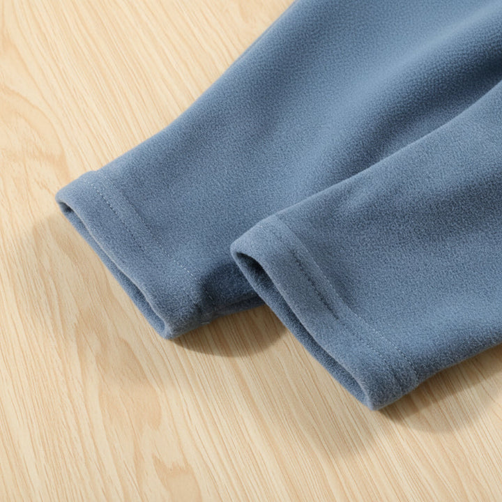 Close-up of the finished hems on blue pajama pants.