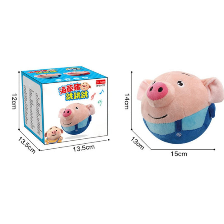 Blue-outfit pig toy beside its retail box with labeled measurements