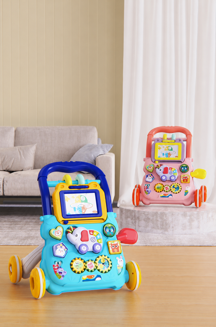 Blue and pink baby push walkers with activity panels displayed beside a sofa