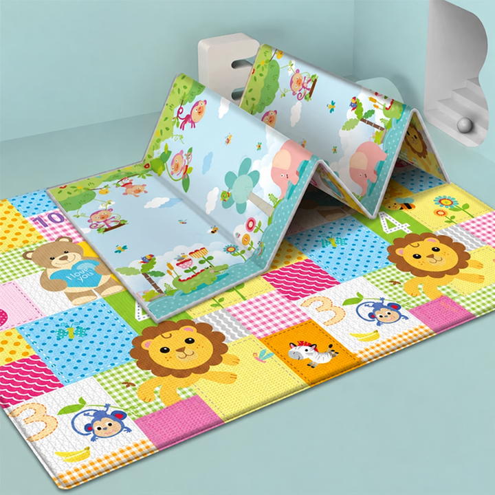 Blue play mat with animal and tree illustrations displayed in accordion folds