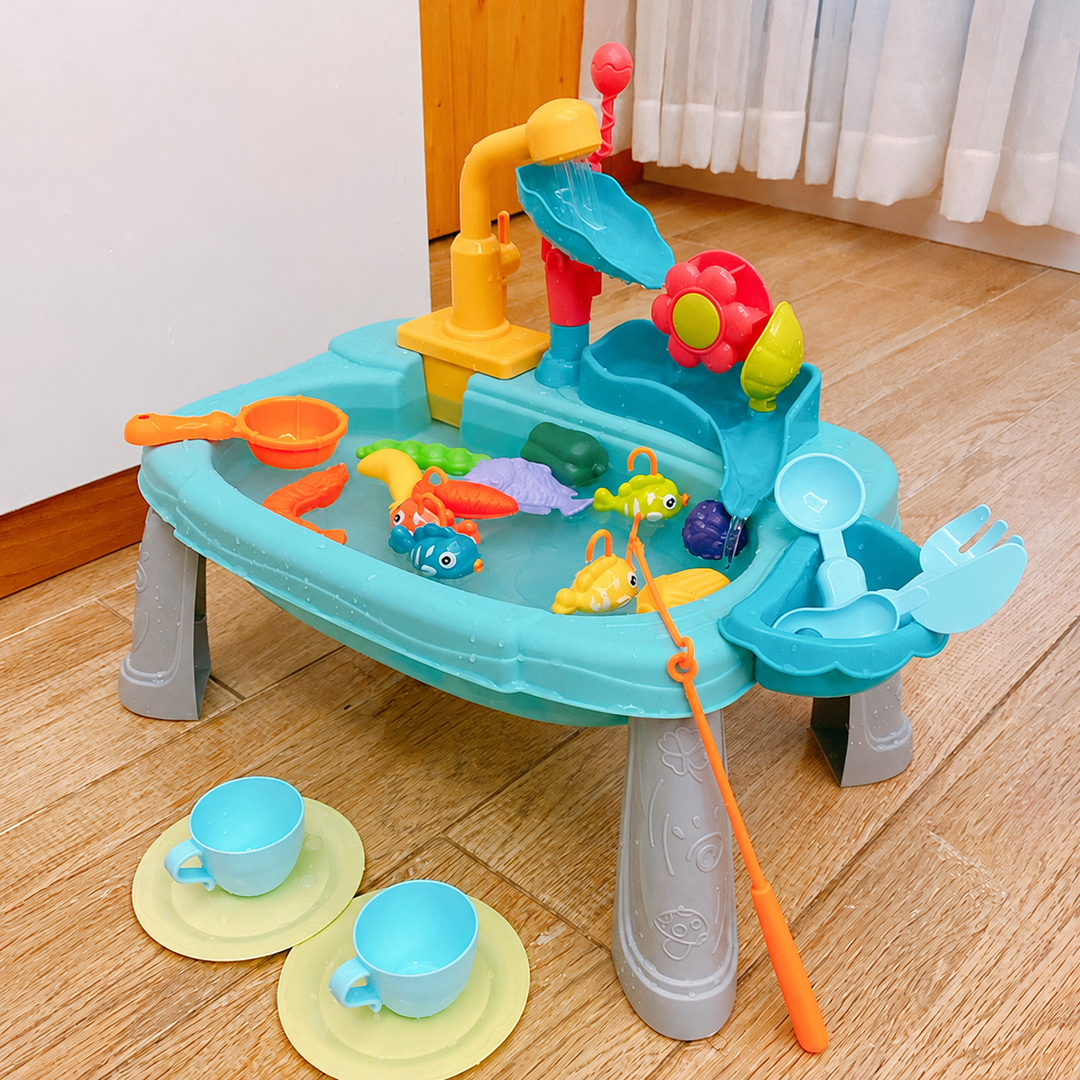 Blue play sink on legs with a faucet, flower water wheel, fishing rod, fish, cups and plates