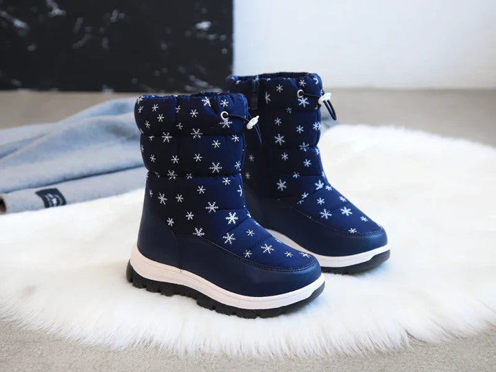 Pair of blue snowflake-print snow boots with padded cuffs and dark treaded soles