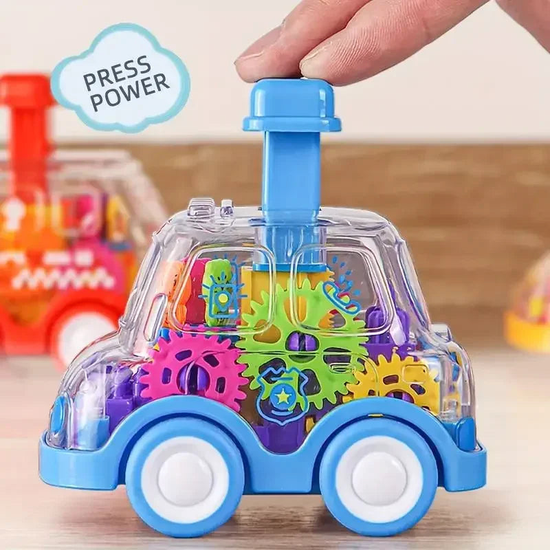 Hand pressing the blue top button on a police toy car with a clear body and colorful gears