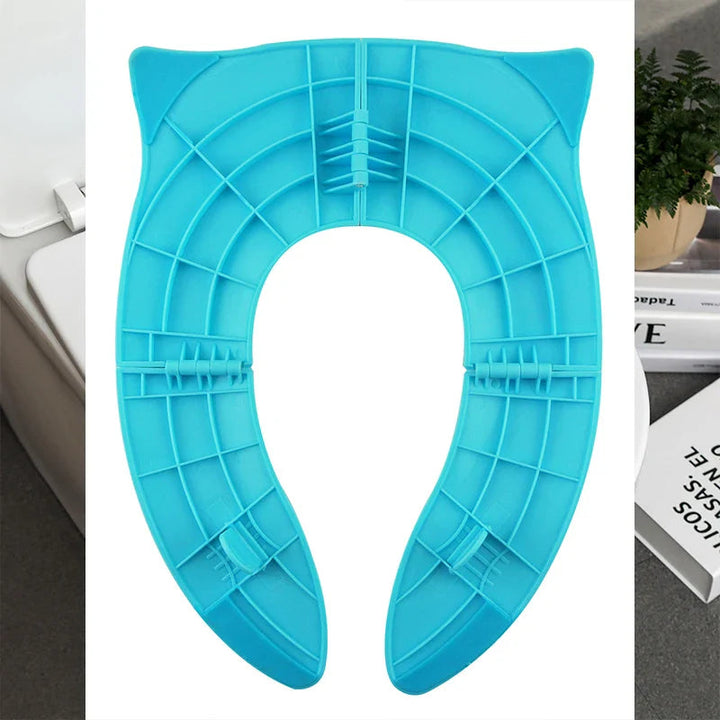 Underside of a blue folding toilet training seat with molded support ribs