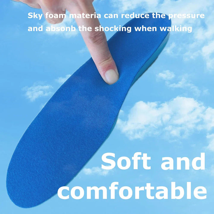 A finger pressing the soft blue foam surface of an insole
