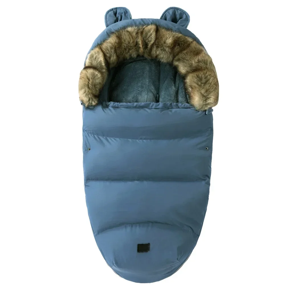 Blue quilted stroller footmuff with a faux fur collar and small matching ears