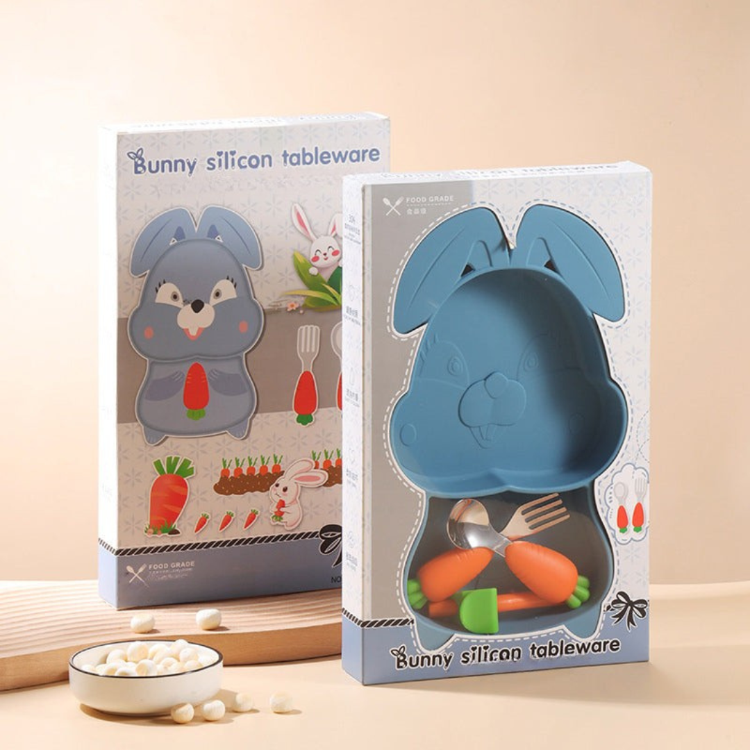 Blue rabbit-shaped plate and carrot-handled cutlery displayed in tall packaging