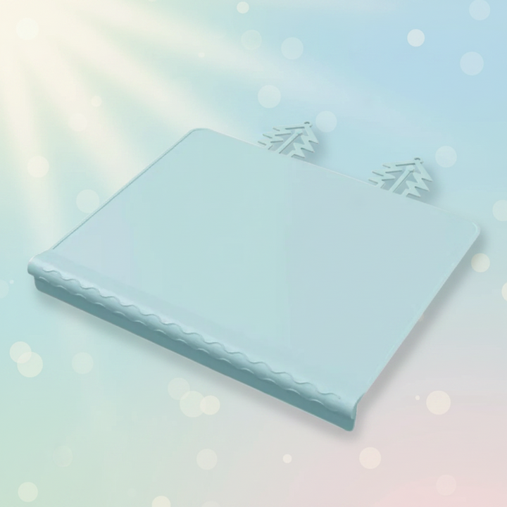 Blue silicone placemat with raised edging and two tree-shaped tabs