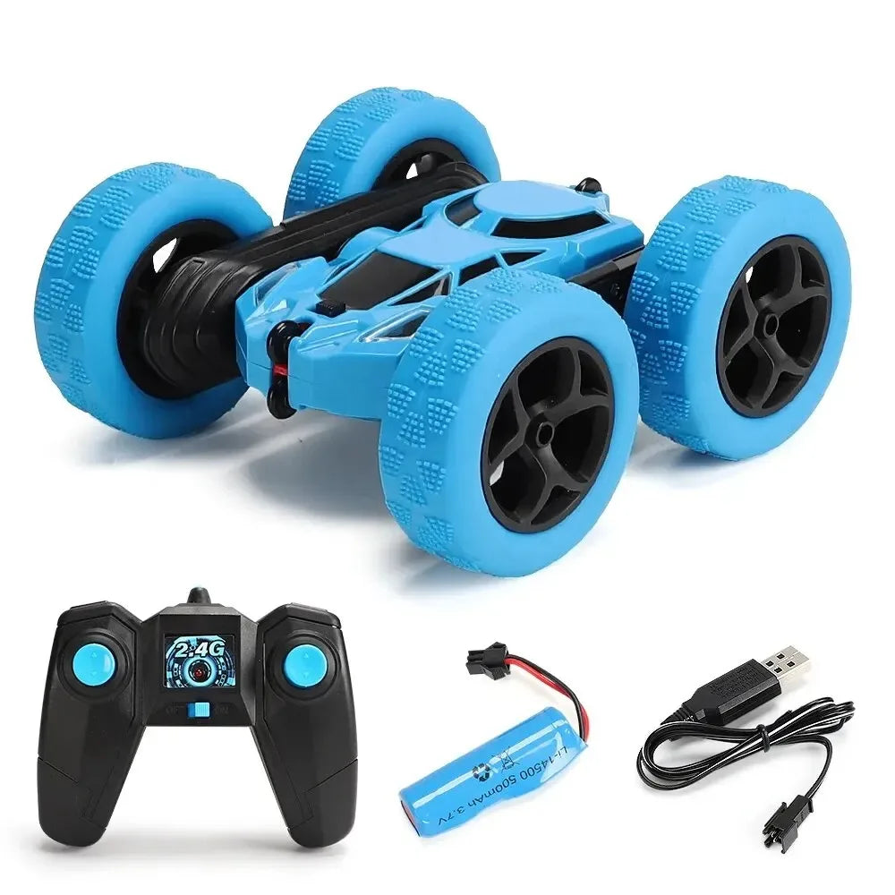 Blue RC stunt car with wireless controller, battery, and USB charging cable